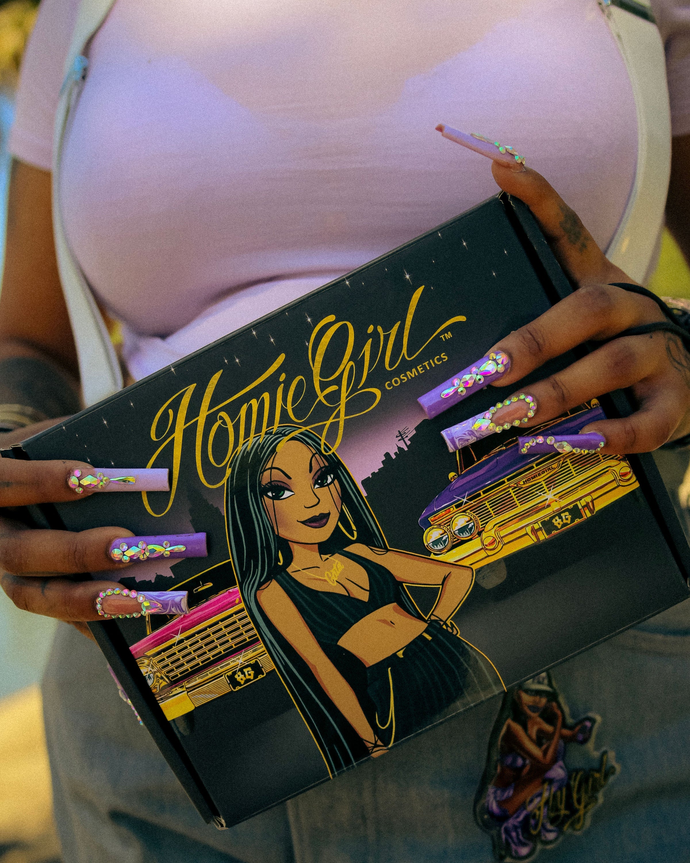 Chicana model wearing HomieGirl Cosmetics – bold makeup look featuring eyeliner, eyeshadow, and street-style glam inspired by firme beauty culture