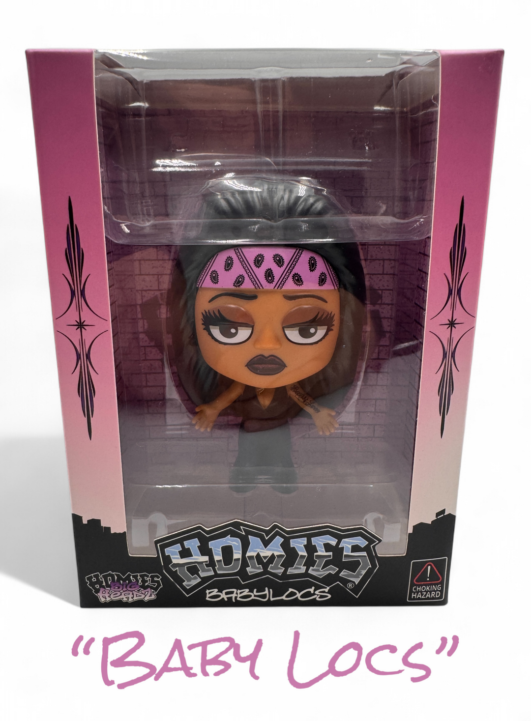 Close-up of HomieGirl collectible figure – detailed design inspired by Chicana street style and Homies legacy, Baby Locs.