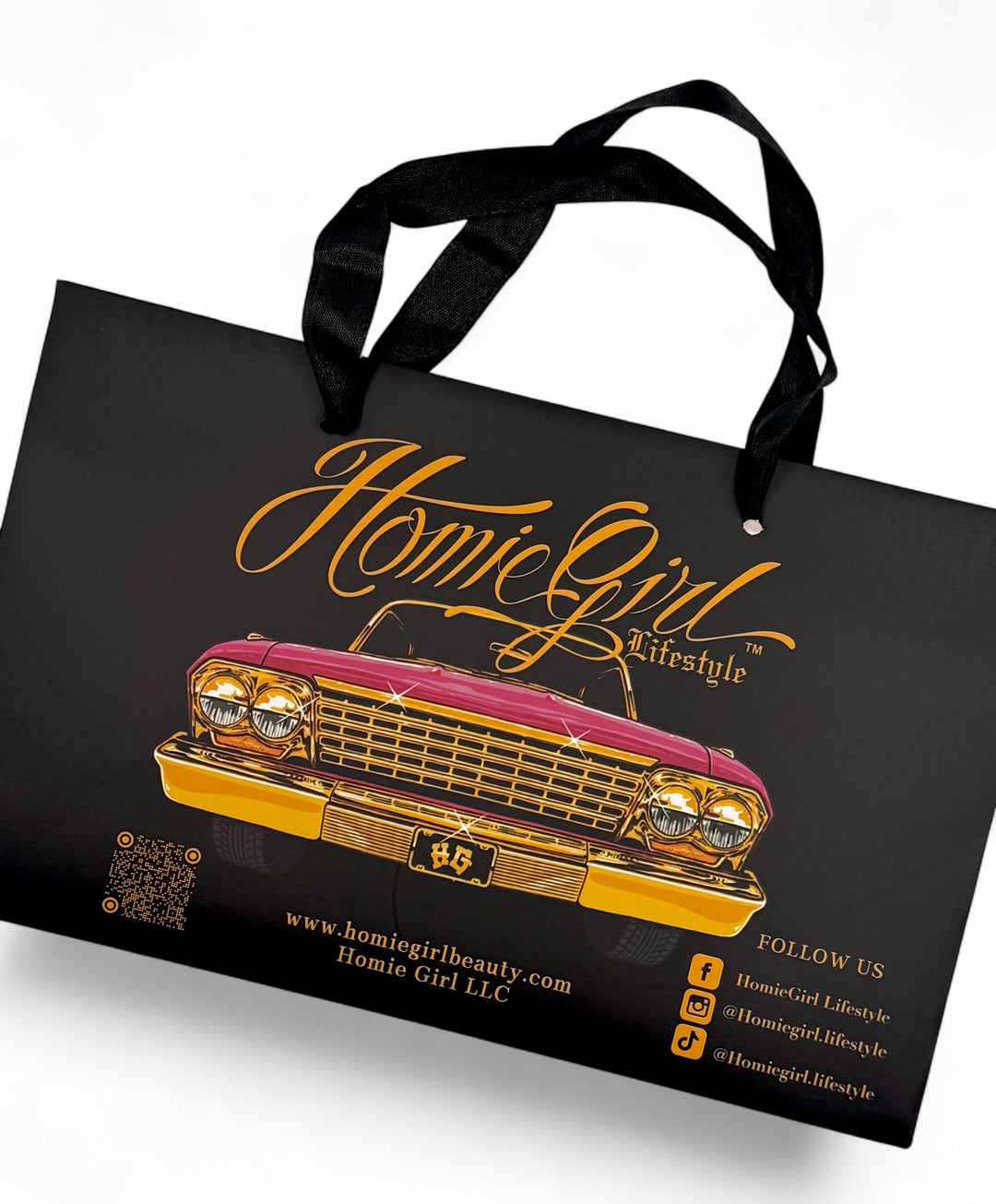 Black tote bag with a pink and gold lowrider car, inspired by the Iconic 90s Homies Brand.